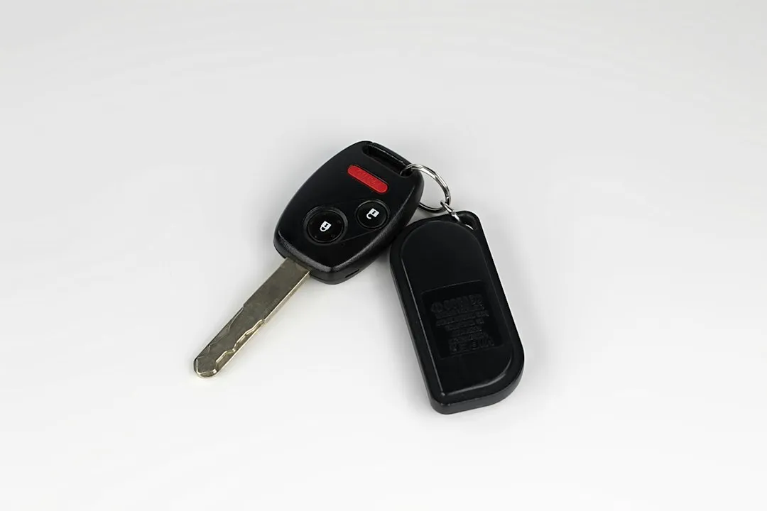 a car key with a remote control attached to it